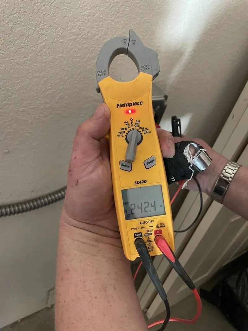 Voltage testing with clamp meter during Generator Installation in Hendersonville